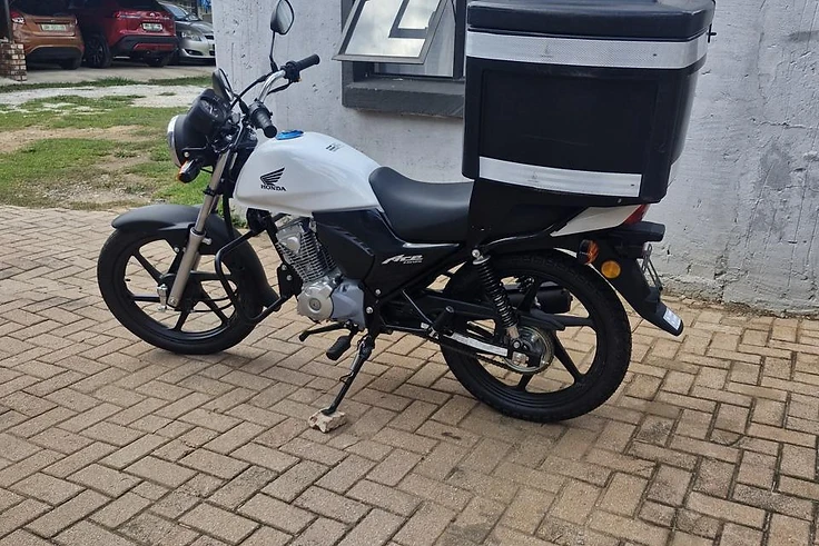 Scooter Lab delivery rider with a Honda Ace motorcycle in Potchefstroom