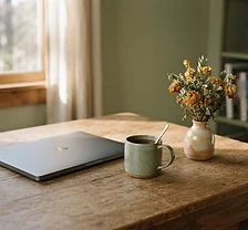 Quiet home workspace with mug and dried marigold flowers