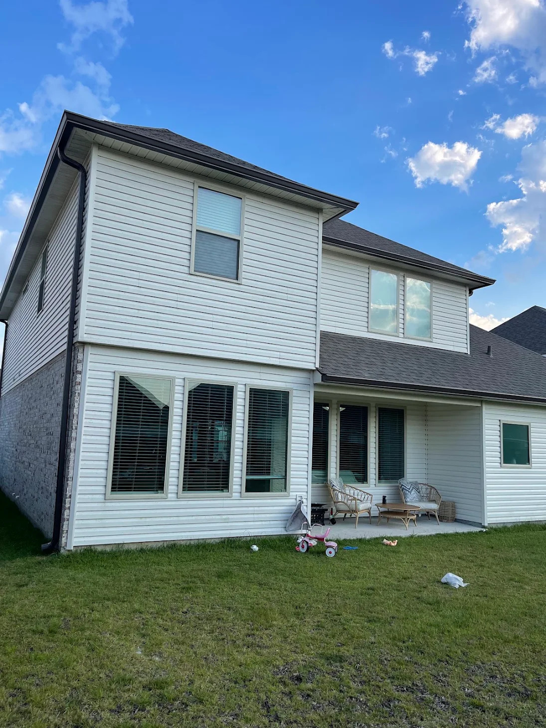Dark gutters on a two-story home's rear elevation