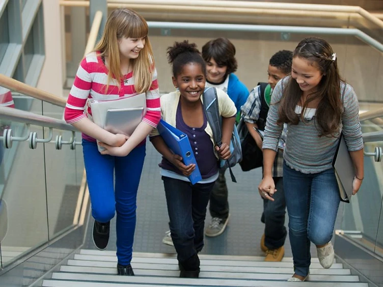 A group of students walking together, representing the youth Right Step serves