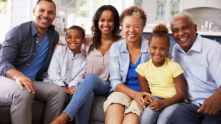 A multi-generational family sitting together, representing the families Right Step serves