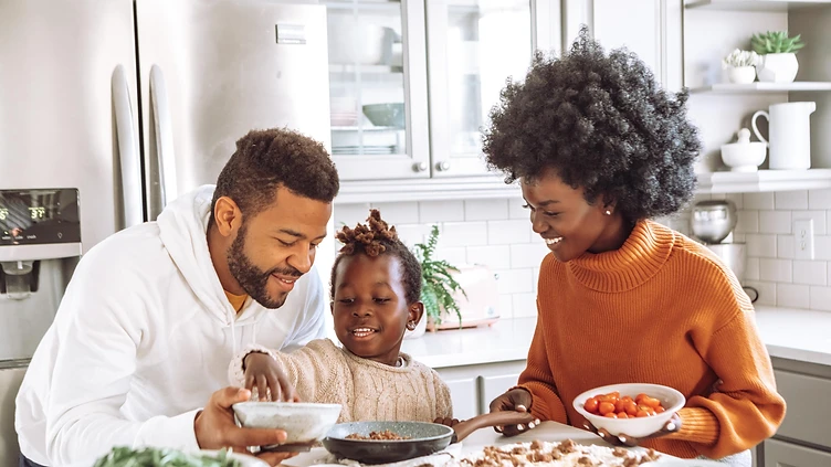A family preparing a meal together, representing the families Right Step serves