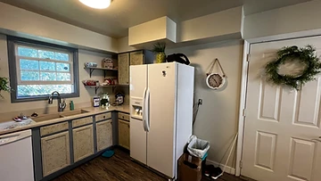 Kitchen with beige cabinets before painting Indiana