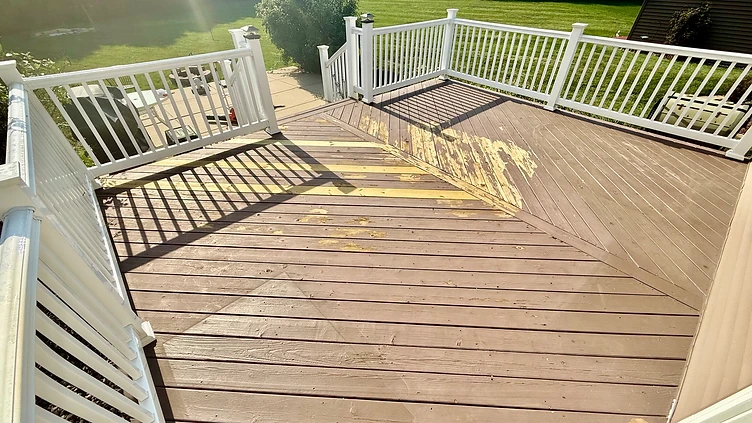 Weathered peeling wooden deck before staining Indiana