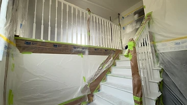 Spindle staircase prepped and masked for painting Indiana