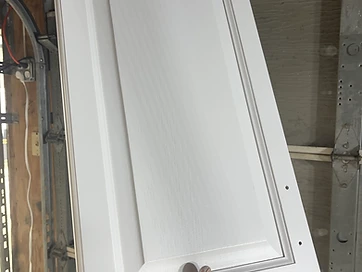 Freshly painted white cabinet door with smooth satin finish Northwest Indiana