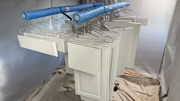 Cabinet doors spray painting in booth Indiana