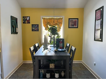 Interior dining room with mustard yellow accent wall painted by PTL Painting in Valparaiso IN