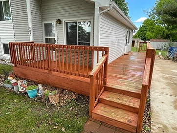 Completed deck staining with rich reddish brown finish Northwest Indiana