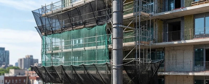 Vertical debris garbage chute on a building under construction
