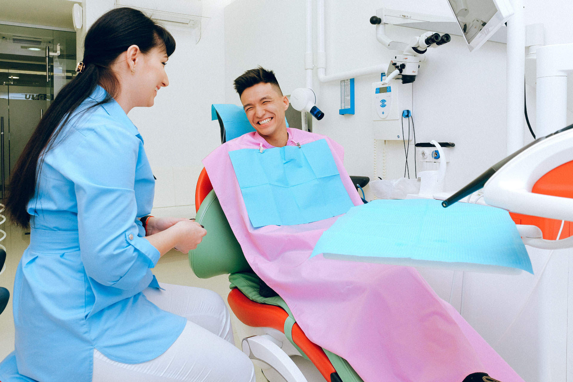 Dentist and patient sharing a positive moment in a modern dental office