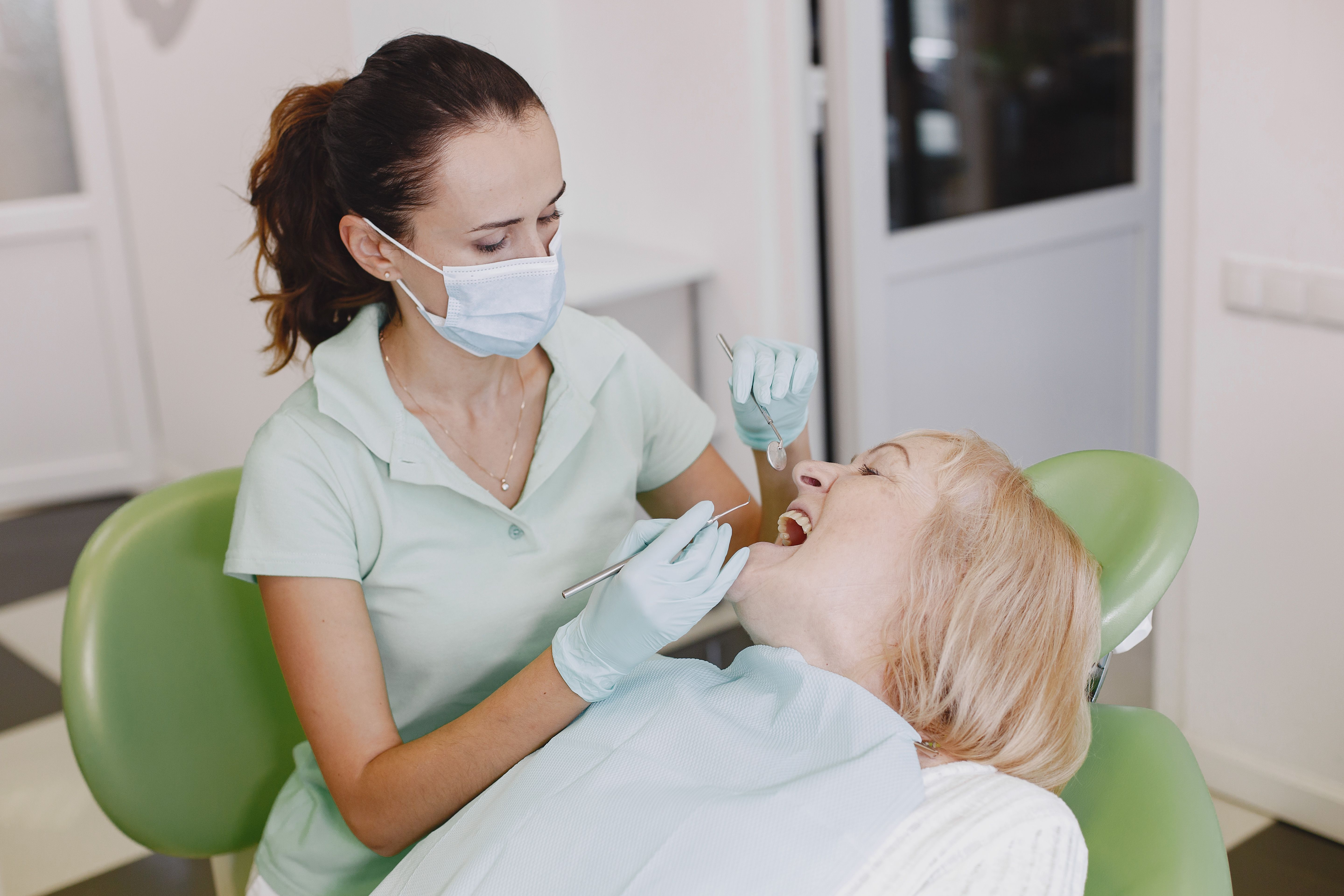 Dentist examining a patient in a modern dental office