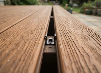 Composite decking board grain close-up with hidden fastener