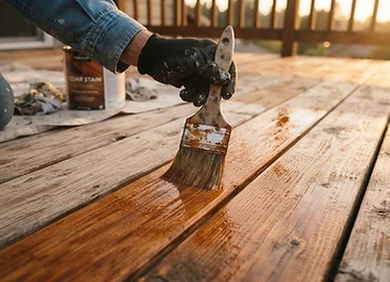 Semi-transparent stain being absorbed into deck boards