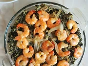 Authentic bowl of Cameroonian Ndolé — bitter leaves and ground peanut stew with shrimp, peanuts and lime