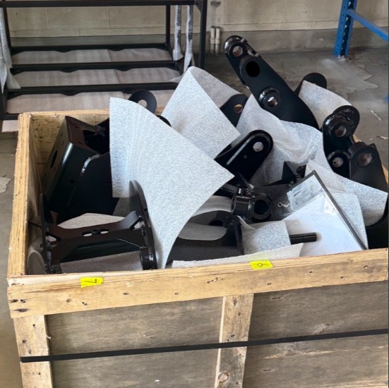 Powder-coated metal components packed and crated for shipment at ICG