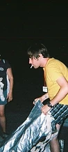 Festival crew handling 8-BIT silver fire suits at night at JescoFest 2006