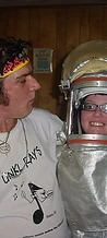 Unkl Ray's crew member with an 8-BIT member in a silver fire suit at JescoFest 2006