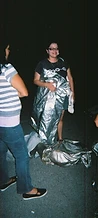 Festival crew holding 8-BIT silver fire suits at night at JescoFest 2006