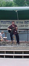 Solo acoustic guitarist performing on the festival stage on Sunday at JescoFest 2006