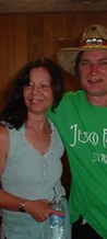Jesco Fest staff member in green shirt posing with a woman indoors at JescoFest 2006