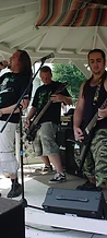 Three-piece rock band performing on the gazebo stage at JescoFest 2006