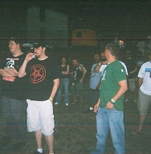 Festival goers posing together on the grass at night at JescoFest 2006