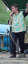 Performer mid-gesture on the outdoor stage at JescoFest 2006