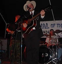 Joey Allcorn performing with bassist and drummer on the night stage at JescoFest 2006