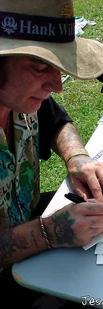 Jesco White signing autographs at a table at JescoFest 2006