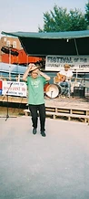 Man dancing on the concrete slab in front of the wooden stage at JescoFest 2006