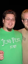 Two JescoFest staff members posing by a truck at night