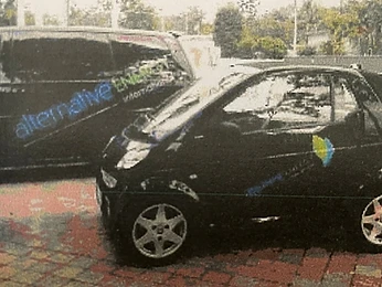 Company fleet vehicles with Alternative Energy International branding
