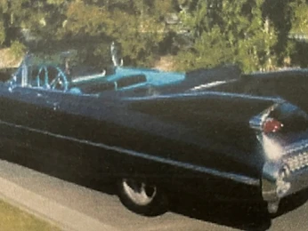 Classic black American convertible with tail fins