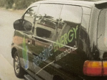 Black company van branded Alternative Energy International
