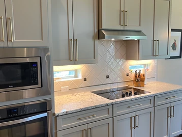 Steiner Ranch kitchen · Mega Greige SW 7031