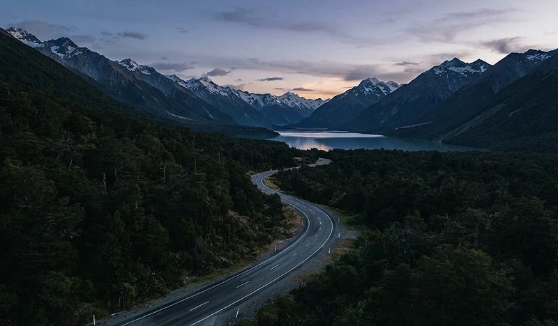 A scenic New Zealand mountain road at dusk