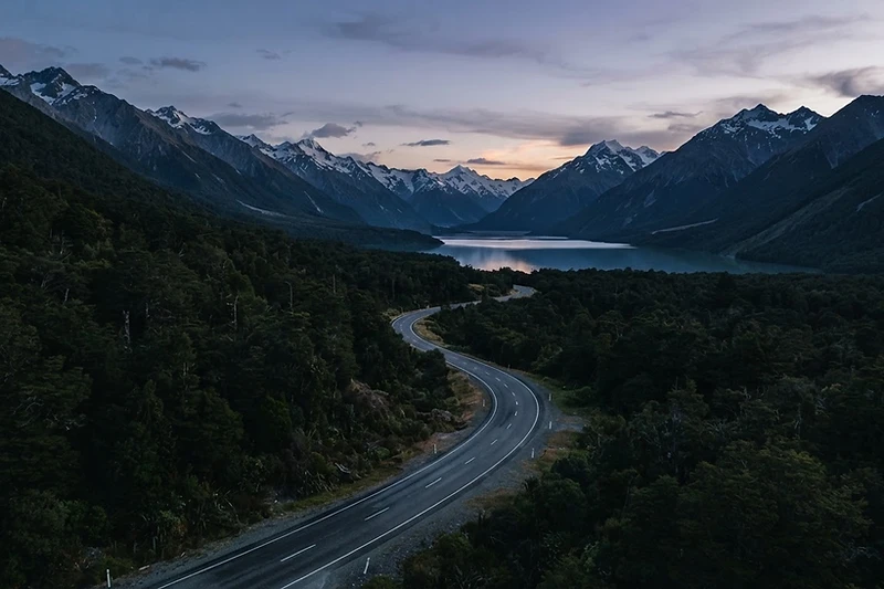 A quiet scenic New Zealand road at dusk