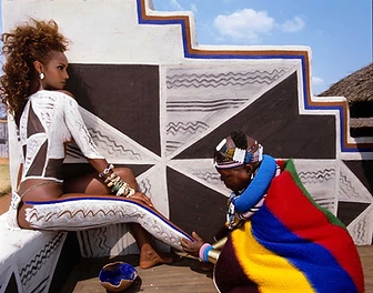 Esther Mahlangu painting the body of supermodel Iman, 1991