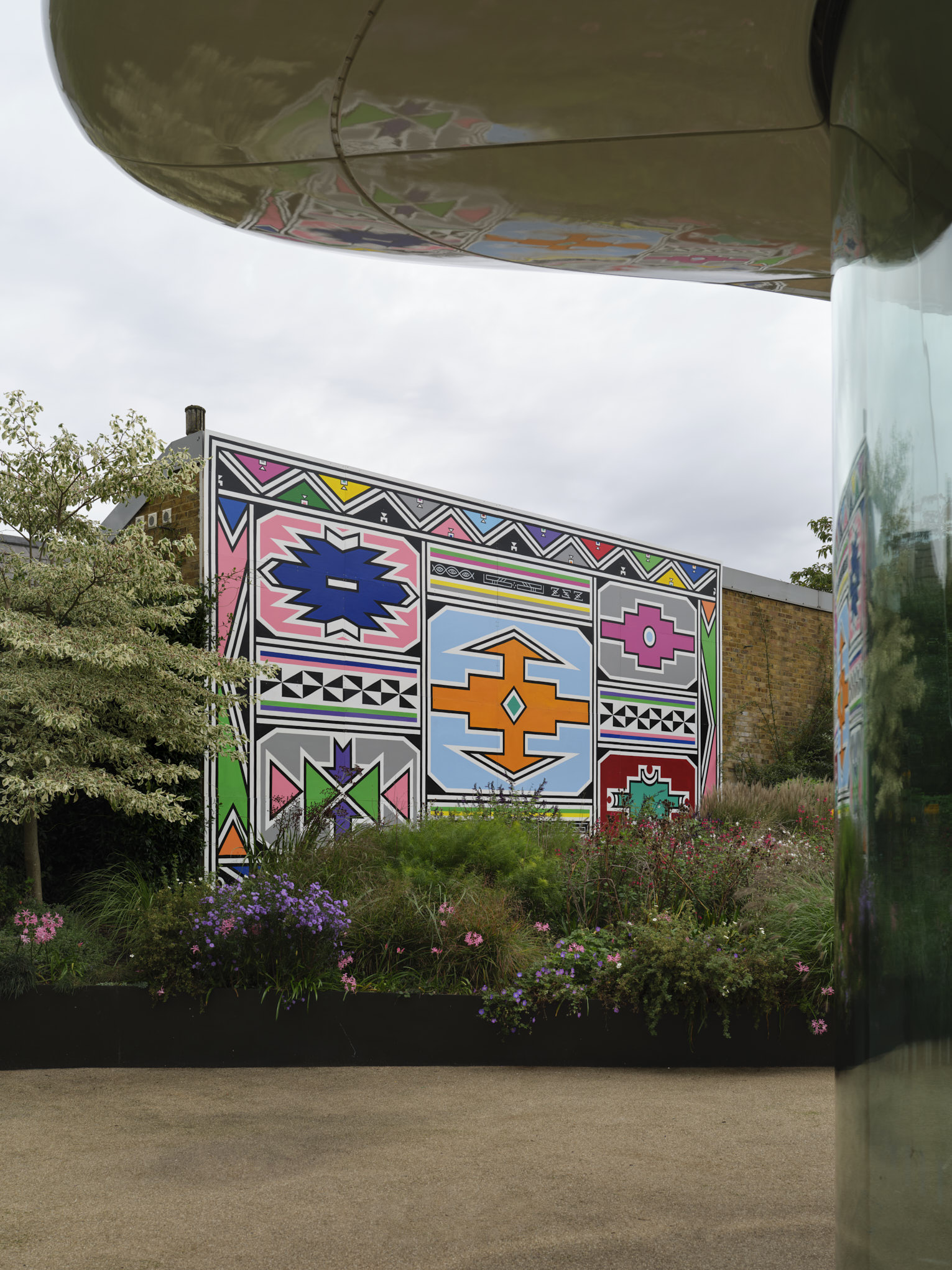 Outdoor Ndebele mural panel by Dr Esther Mahlangu