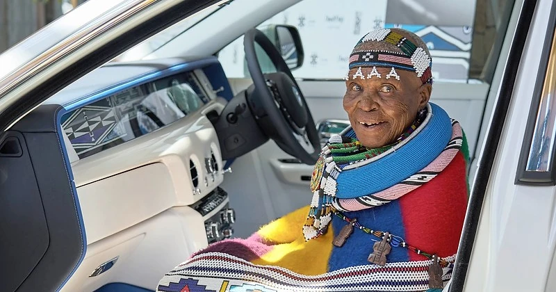 Dr Esther Mahlangu seated inside the bespoke Rolls-Royce Phantom, featuring her hand-painted Ndebele artwork in the Gallery. Photo: Willie Botes