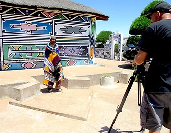 Esther Mahlangu being interviewed on camera at her home, by The Melrose Gallery