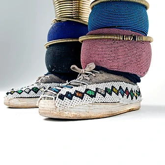 Beaded sneakers and leg rings, by Clint Strydom