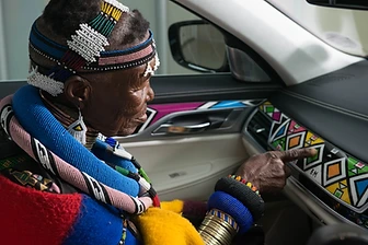 Esther Mahlangu inside the BMW 7 Series with its Ndebele dashboard, 2024