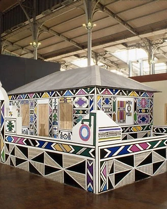 Dr Esther Mahlangu's painted Ndebele house installation at Les Magiciens de la Terre, Grande Halle de la Villette, Paris, 1989