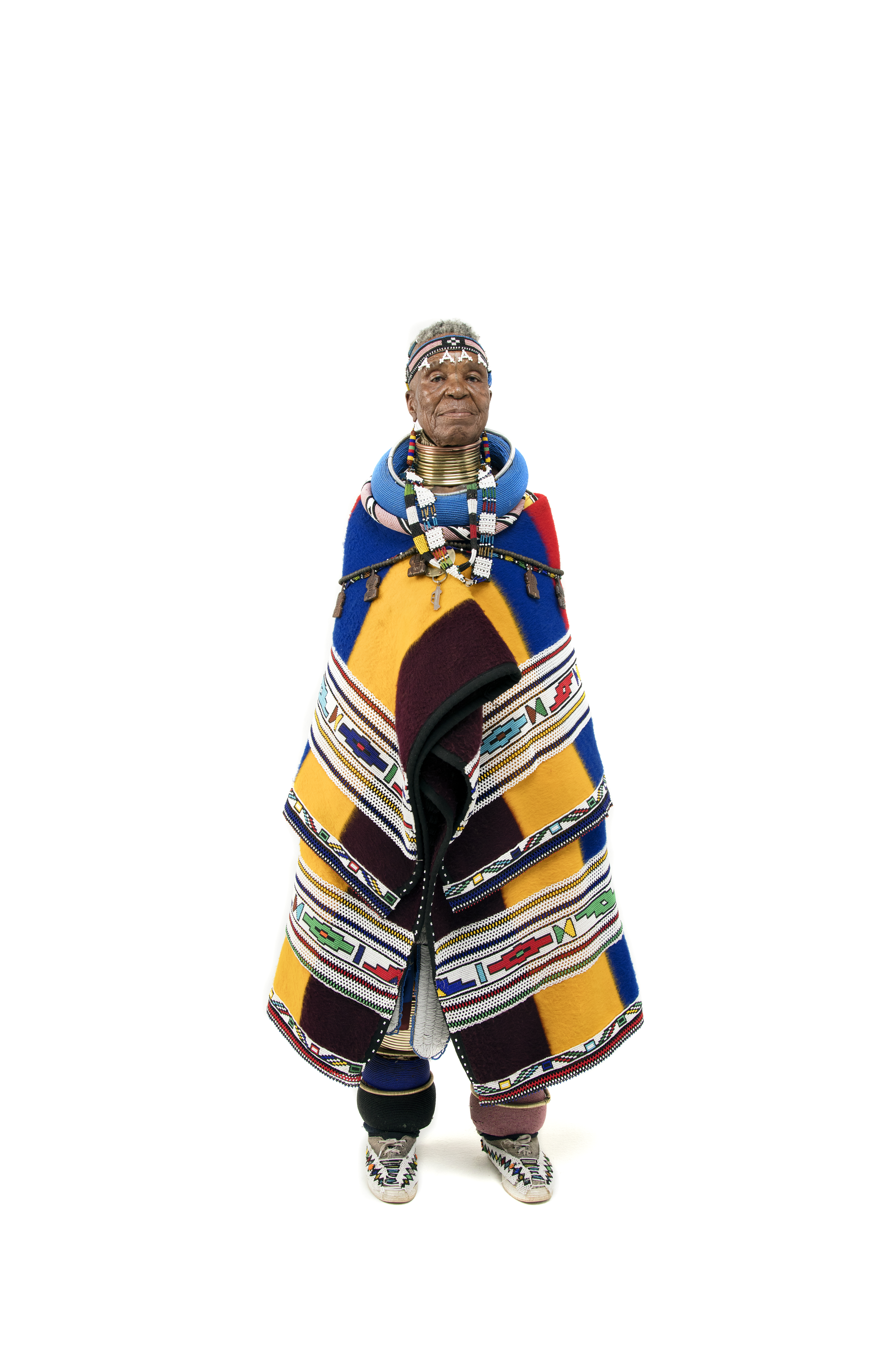 Dr Esther Mahlangu, full-length studio portrait in traditional Ndebele attire, by Clint Strydom
