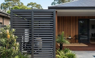 Charcoal aluminium louvre privacy screen on a contemporary Australian home