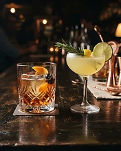 Two craft cocktails side by side