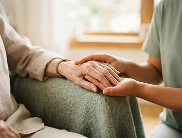 Caregiver holding a loved one's hand