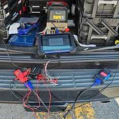 Key cutting and programming equipment set up in a vehicle trunk